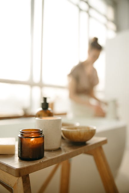 Home Warm, calming bathroom scene with candle and beauty products. Perfect for relaxation themes.